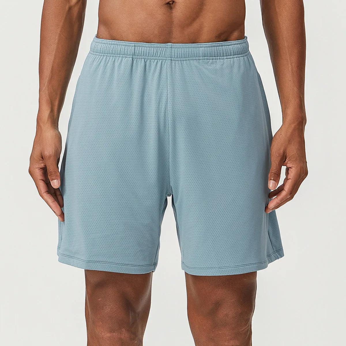Men's double-layer running shorts in sky green colour on a mannequin, showing mid-waist and shorts length.