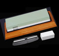 White corundum kitchen whetstone on bamboo base with correction stone and accessories