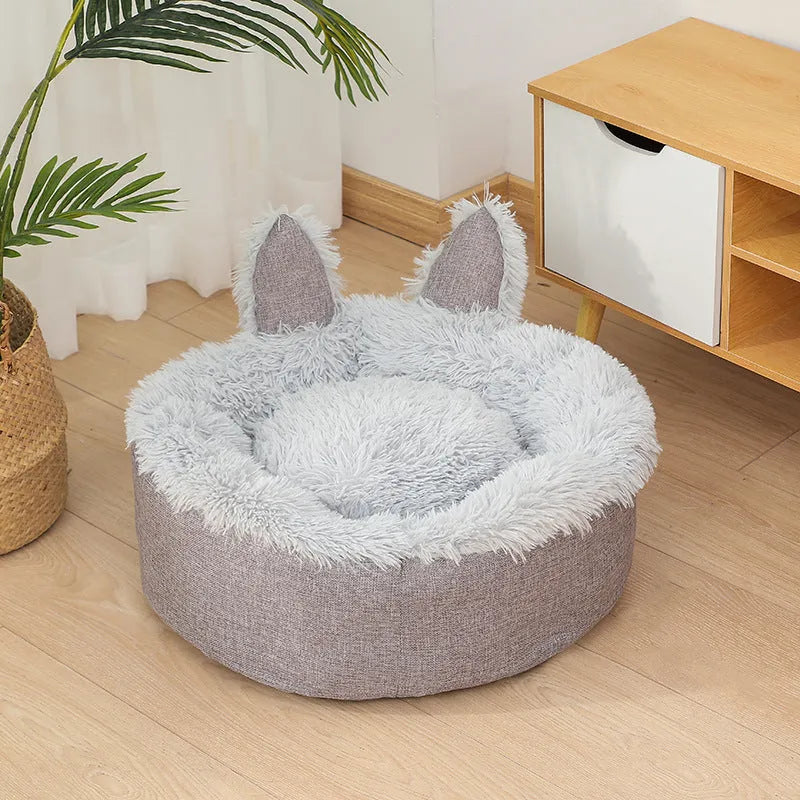 Soft faux fur plush cat bed in grey with fluffy interior – available in multiple sizes and colours for indoor use