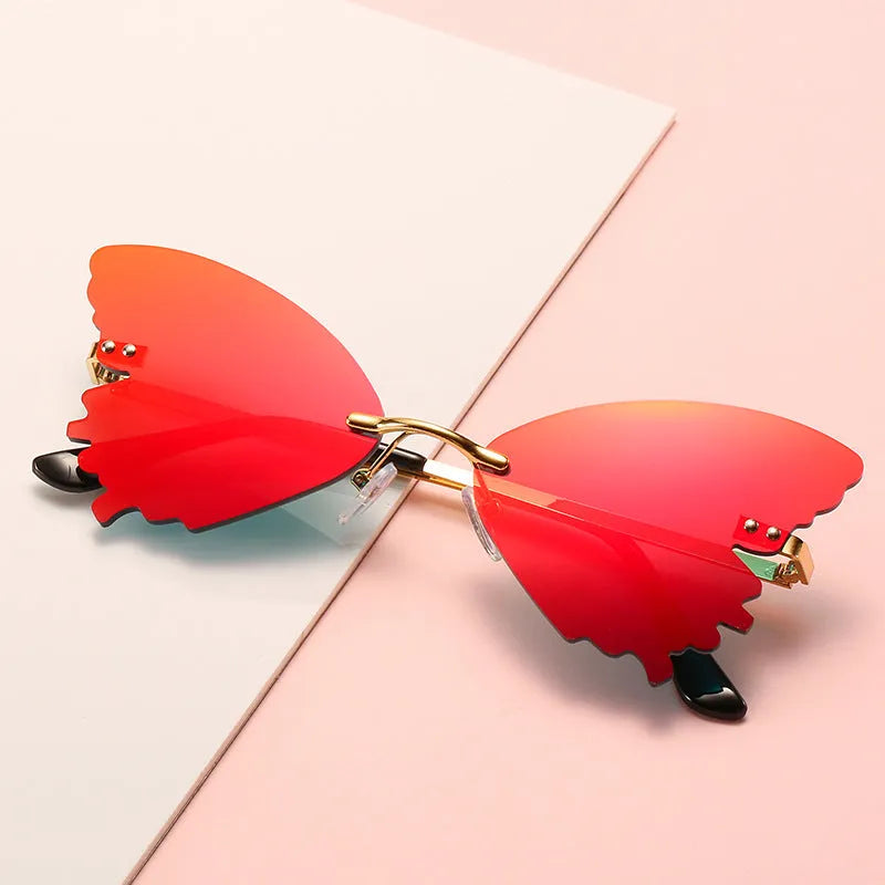 Butterfly rimless sunglasses with UV400 protection, vintage style, plastic and metal frame, available in blue green grey pink purple red yellow
