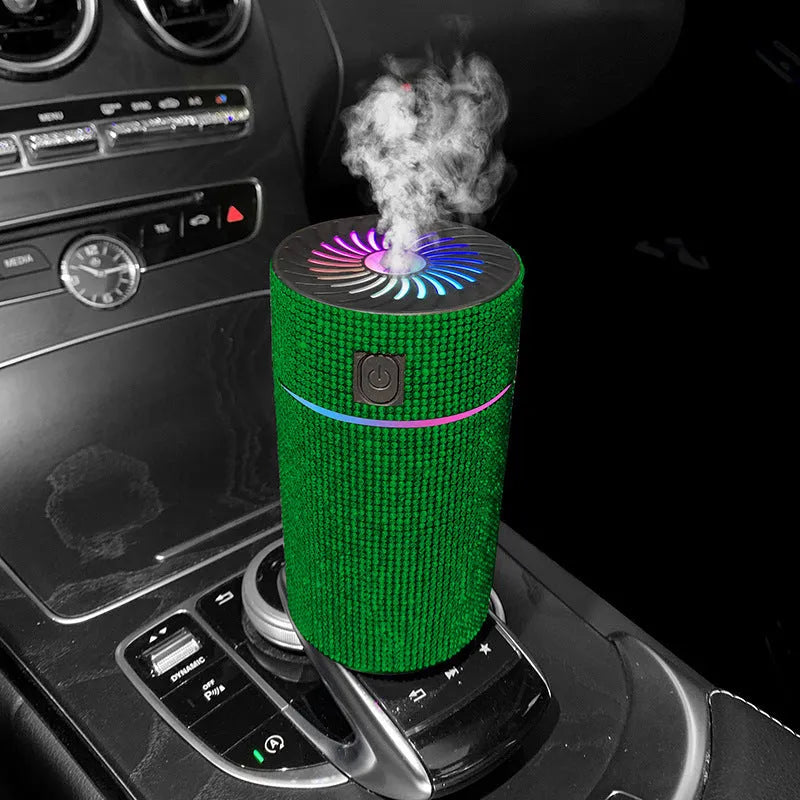 Compact white car air purifier humidifier with USB cord on car dashboard