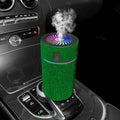 Compact white car air purifier humidifier with USB cord on car dashboard