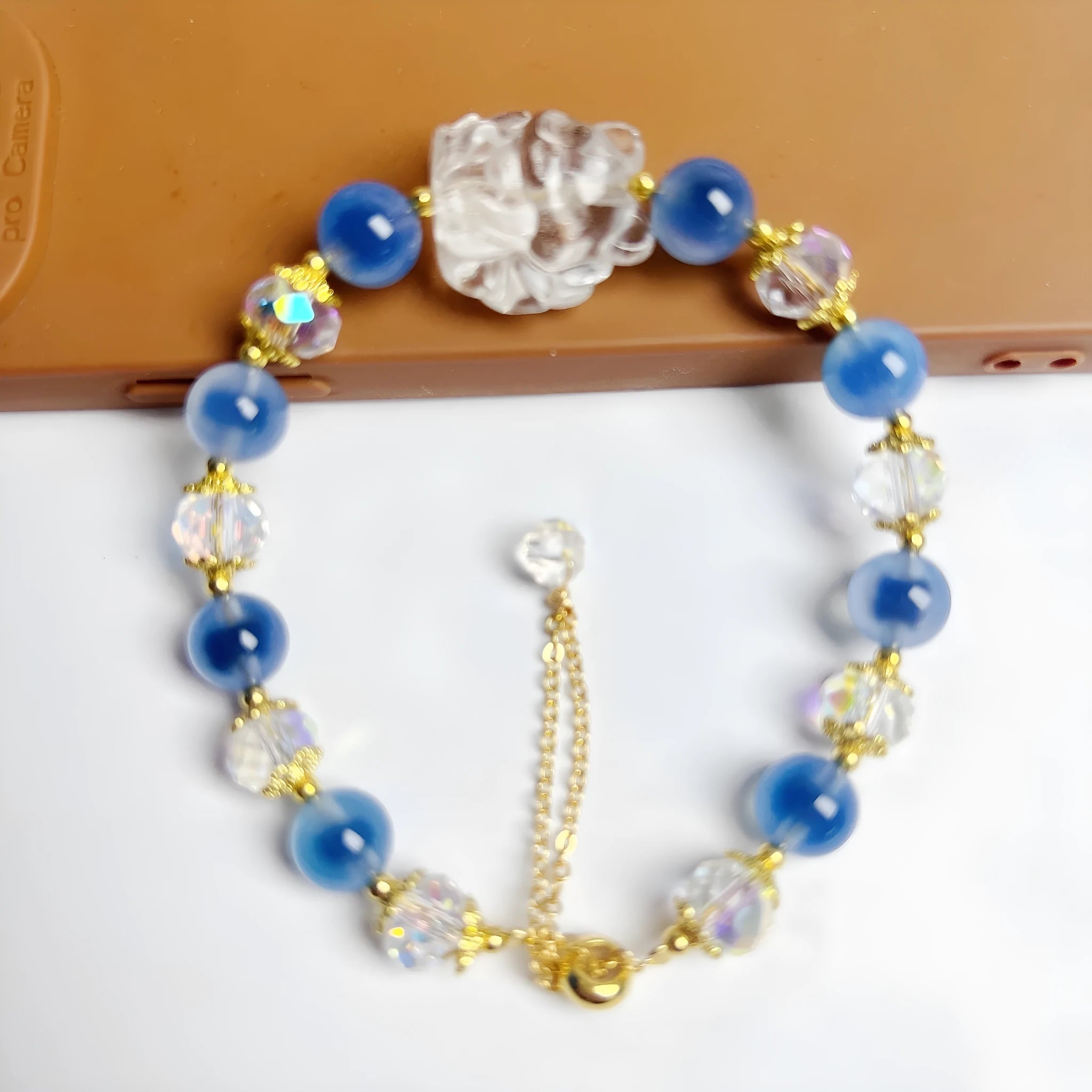 Handmade blue glazed agate nine tail fox bracelet on white background