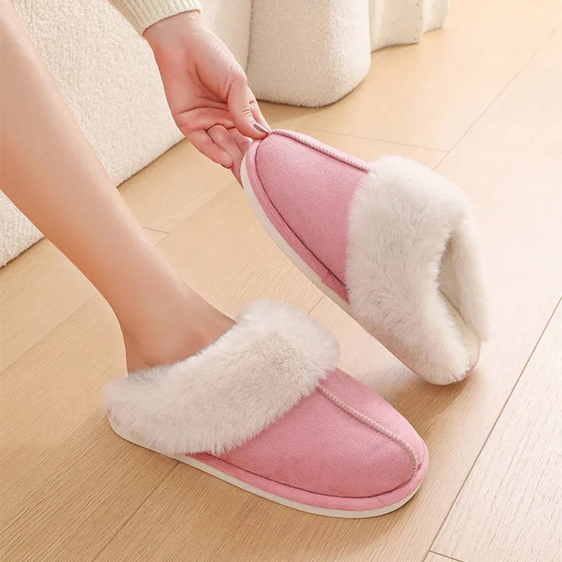 Women's plush winter slippers with artificial wool lining and a PVC sole in multiple colours.