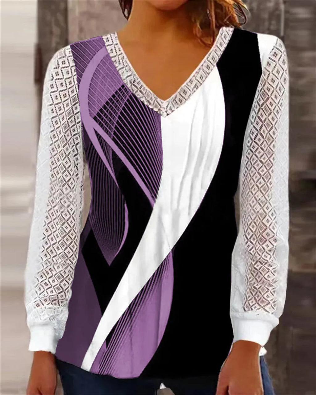 Women's v-neck loose top with hollow-out lace print in purple colour showing front view