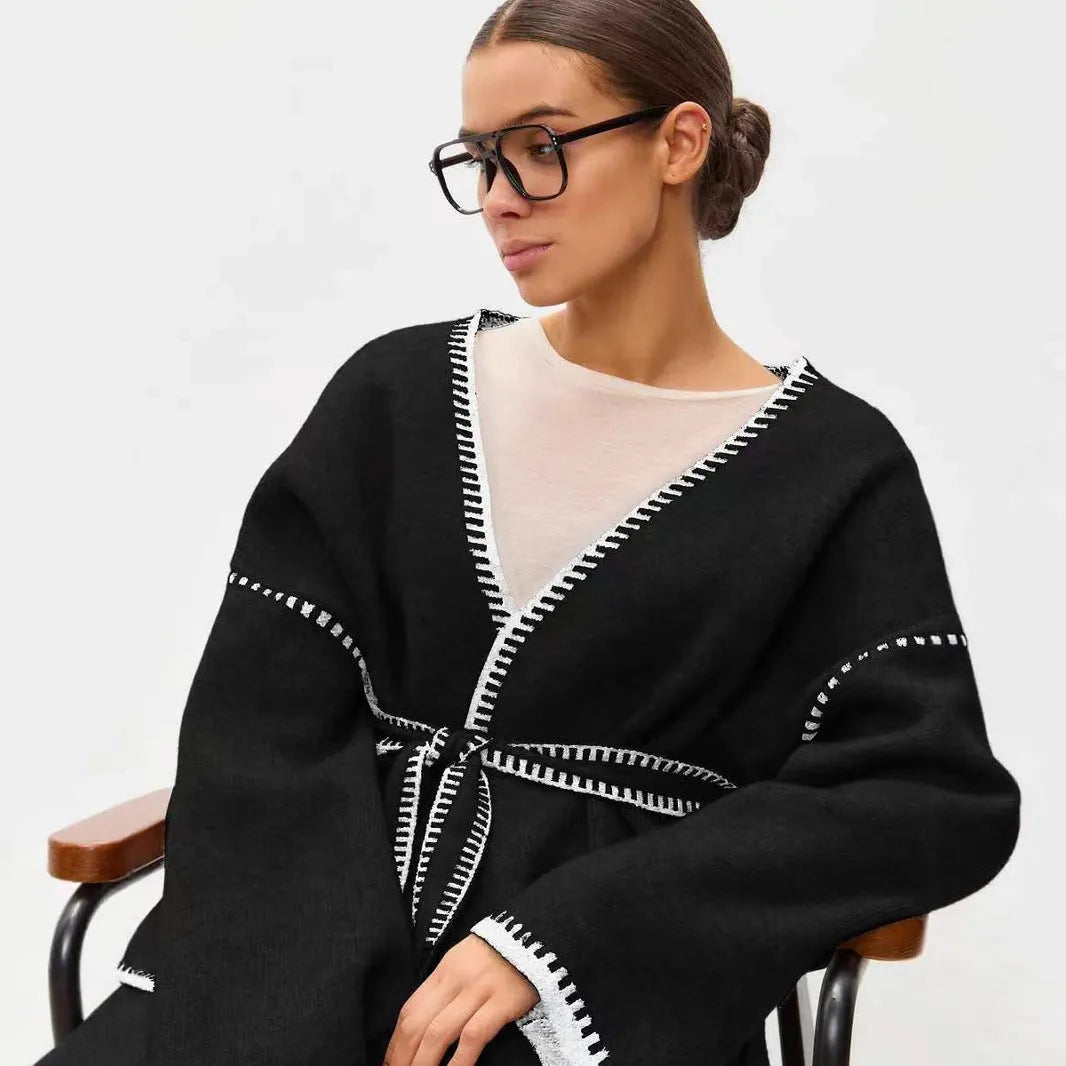 Loose fit lace-up front knitted cardigan in black, camel, or white colours.