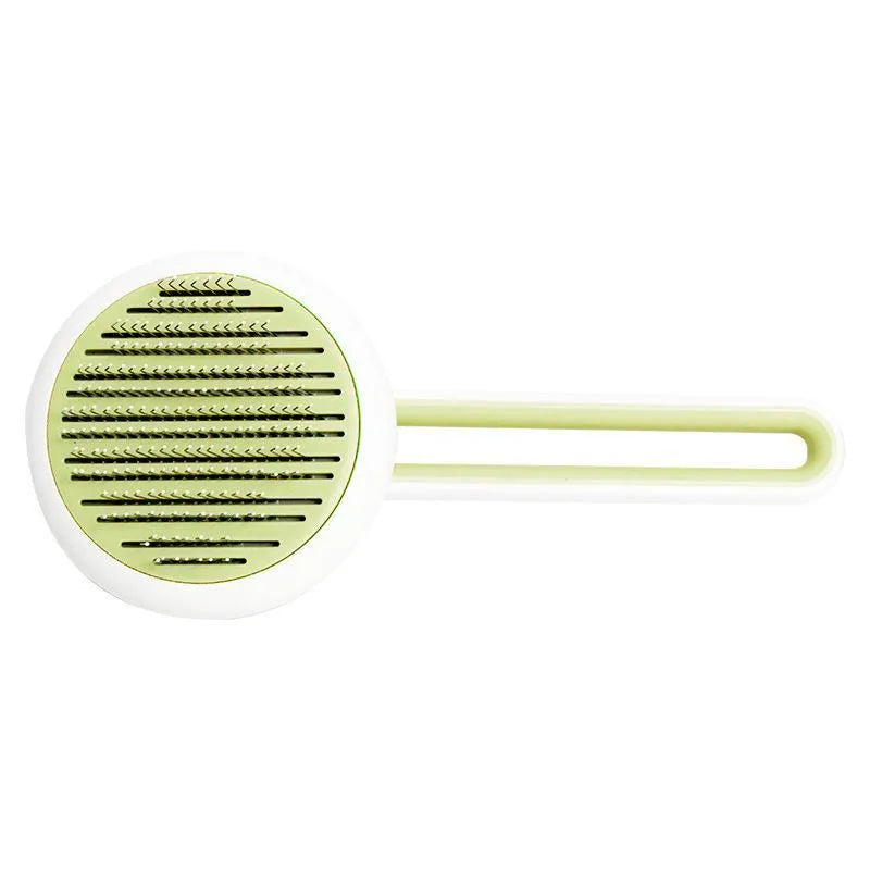 Automatic pet grooming brush with stainless steel pins in blue, green, or pink, showing the handle grip and release button.
