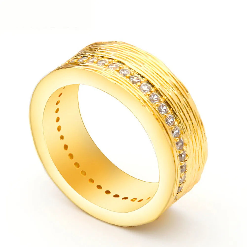 Gold geometric women's zircon ring on a copper base, shown in size 7
