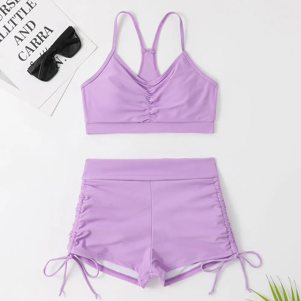 Women's high waist split swimsuit bikini set in purple or black, made from nylon and spandex.