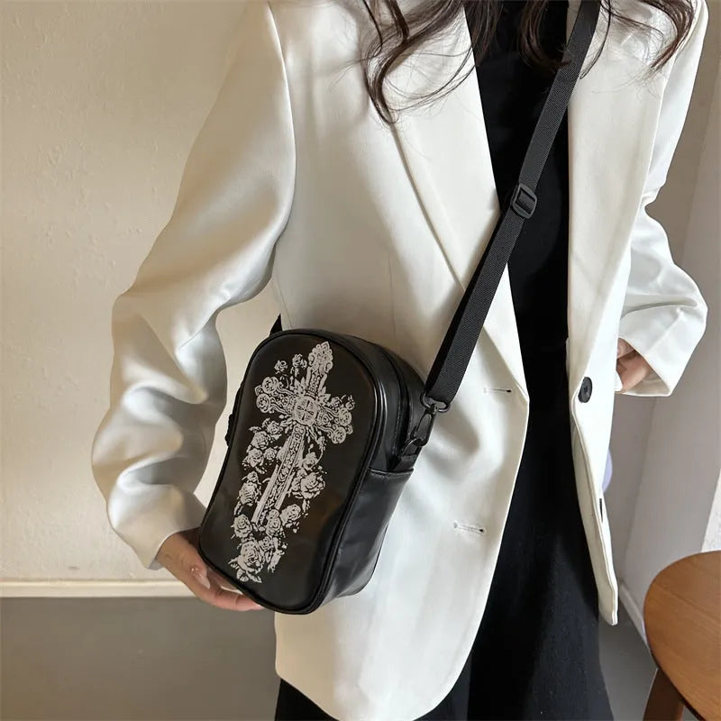 Halloween graffiti print mini crossbody bag with cartoon pumpkin ghost bat design in multiple colours.