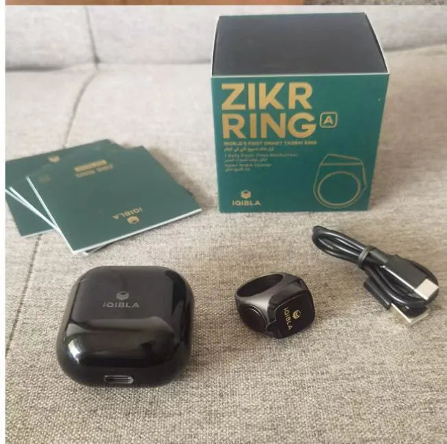 Zikr1 metal smart ring showing OLED display, available in black, green, rose gold, and silver.