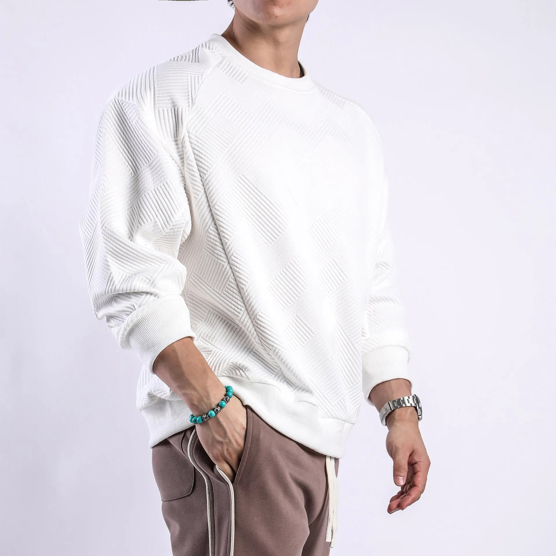 Men's loose fit long-sleeved twill jacquard sweater in Army Green, shown with round neck and regular sleeves.