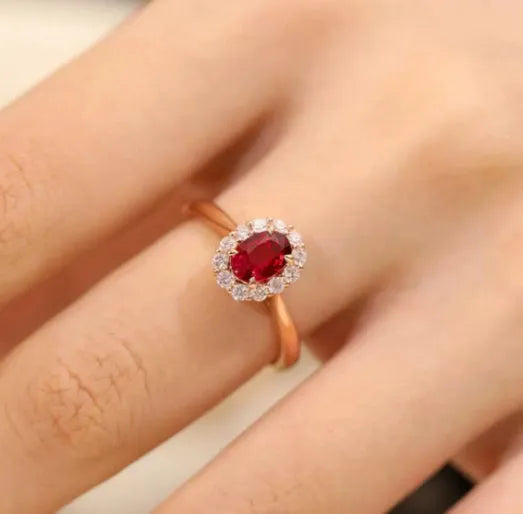 Gold pigeon blood ruby sterling silver ring with floral design and artificial gemstone centre