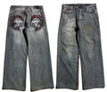Men's washed grey wide-leg straight jeans on a neutral background.