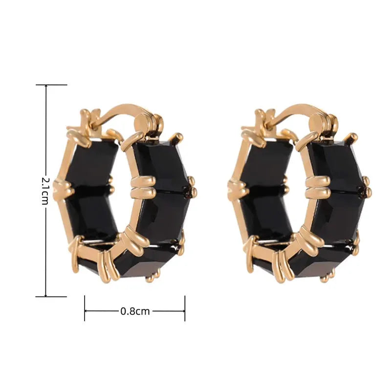 Geometric U-shaped gold earrings with black crystal zirconium stones in round design