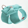 A pink microfiber puppy chest strap with a bowknot, shown alongside blue and orange options.