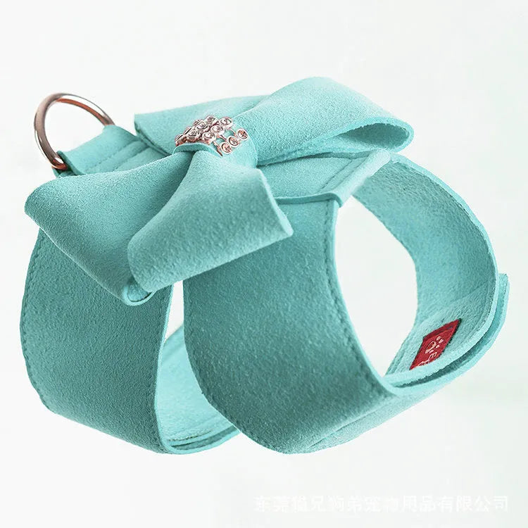 A pink microfiber puppy chest strap with a bowknot, shown alongside blue and orange options.