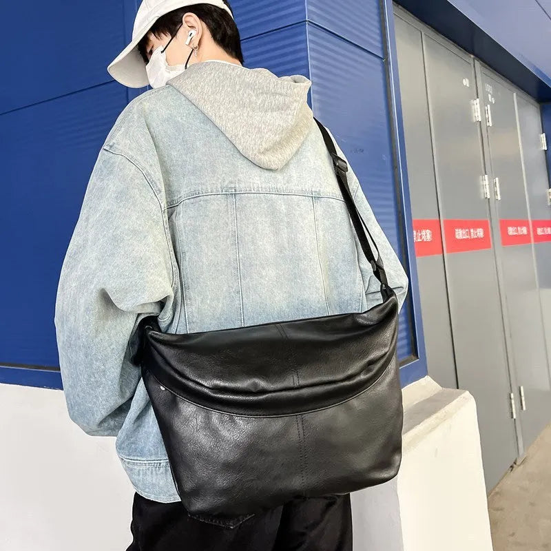 Retro large capacity black PU crossbody bag for men shown with dimensions