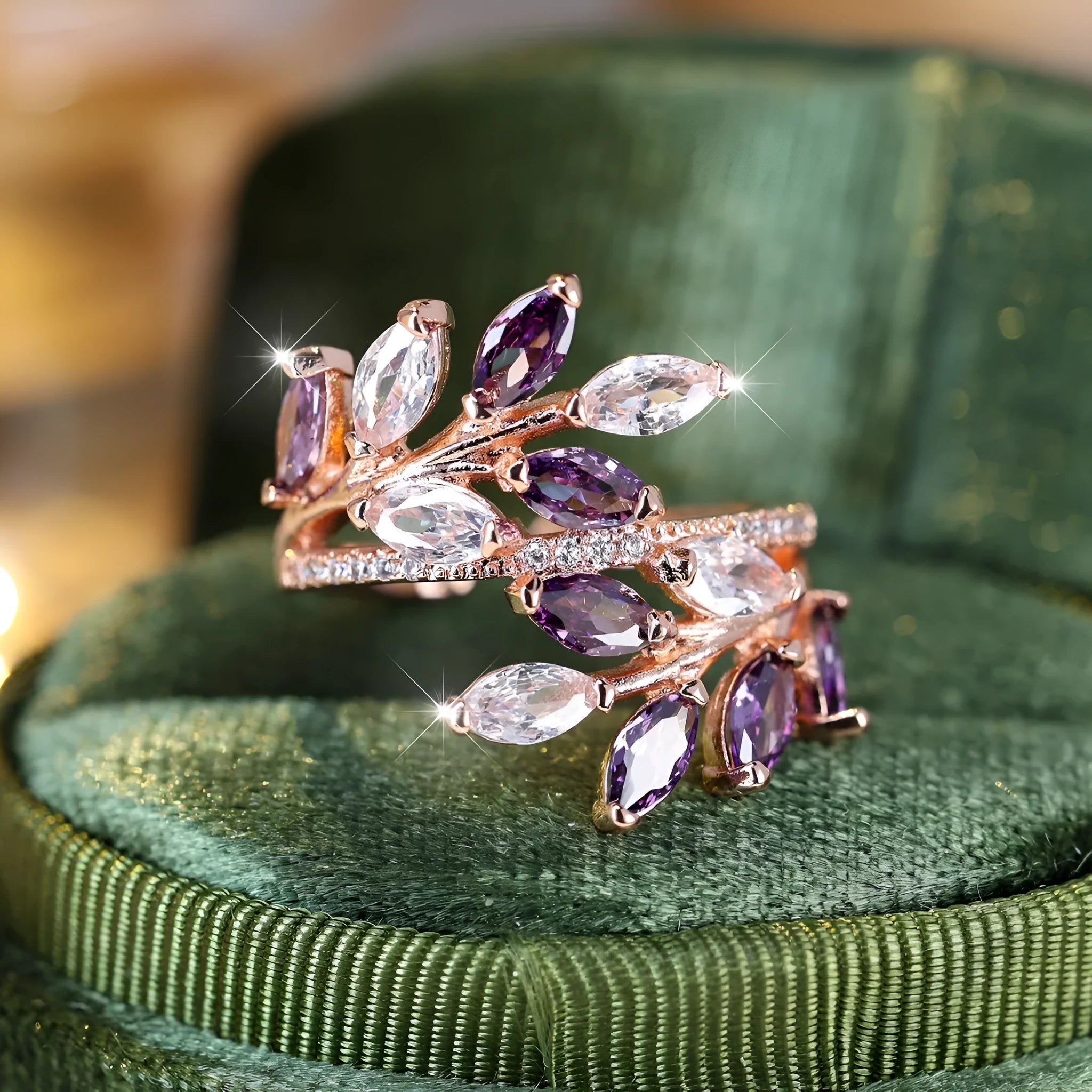 Close-up of an adjustable horse eye zircon leaf fashion ring in a rose gold finish with white stones.