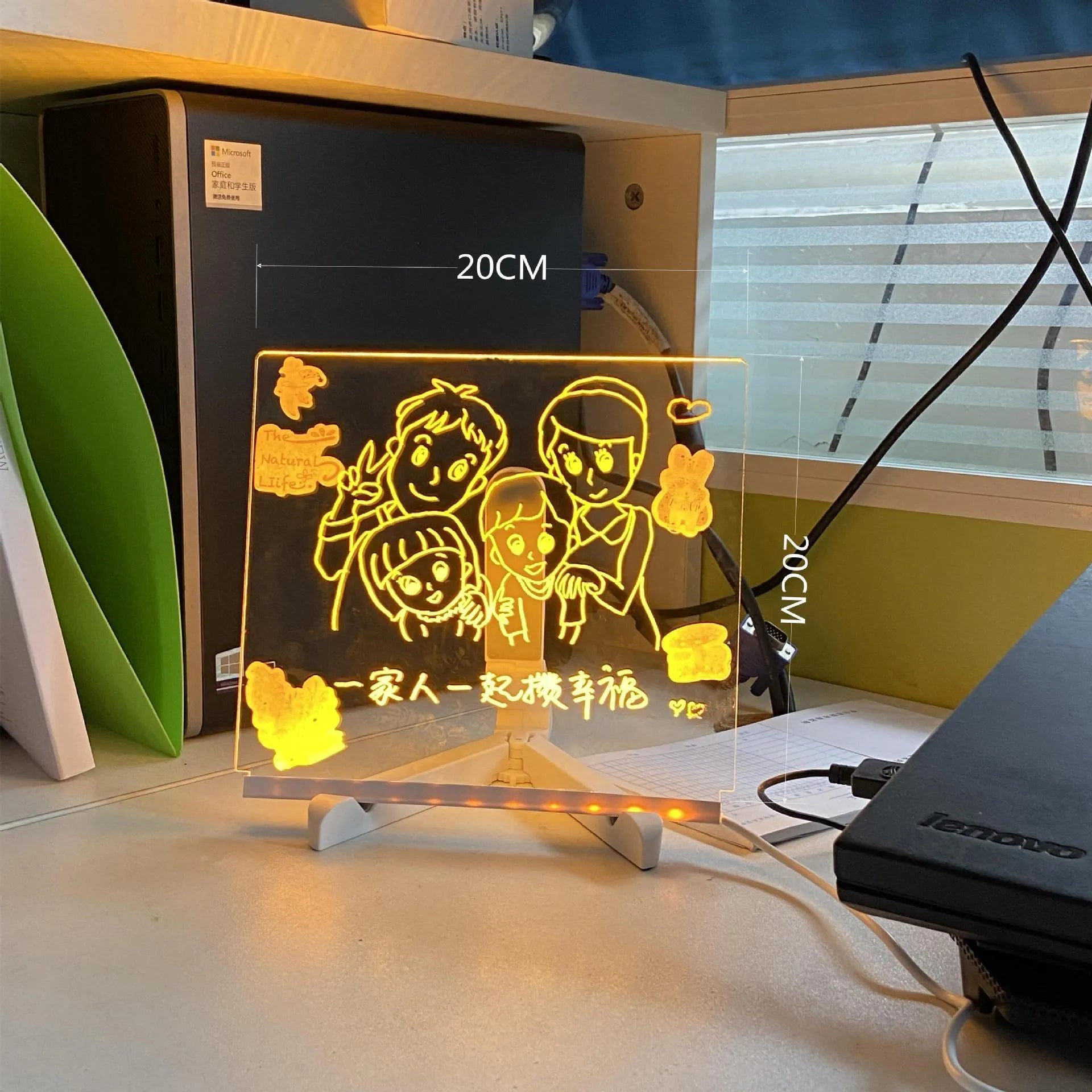 Acrylic LED message board night light on a desk with colourful handwritten notes glowing softly.