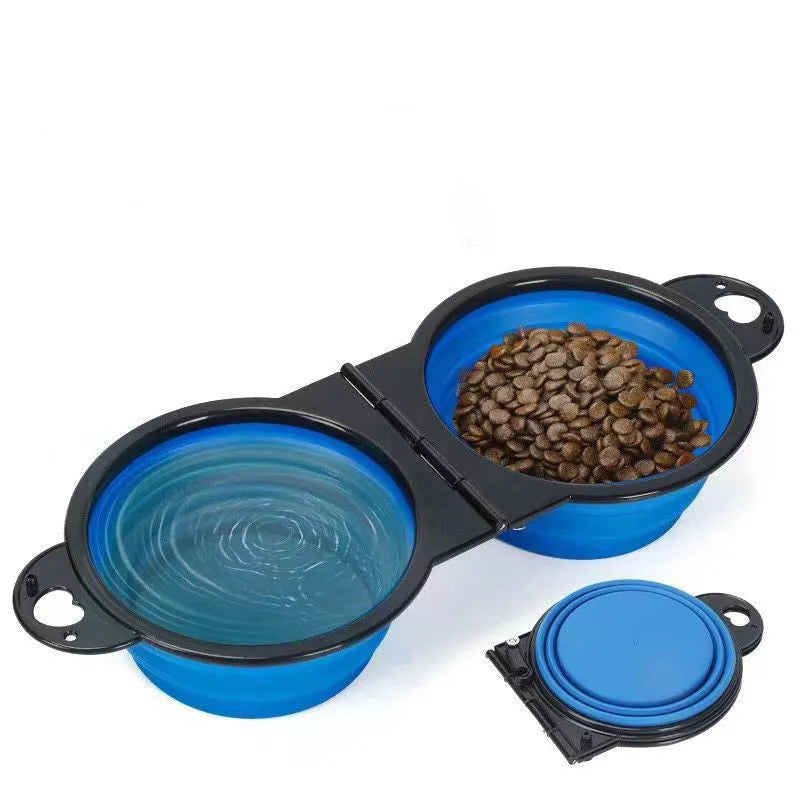 Blue silicone folding double pet bowl showing food and water compartments, folded flat beside it.