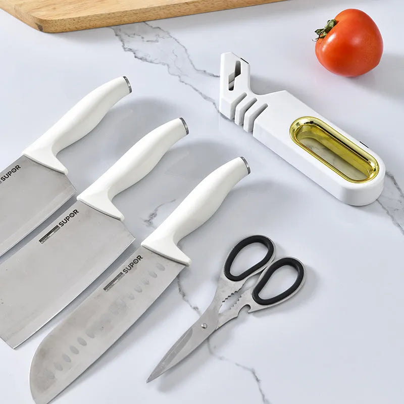 Four-in-one stone manual grinder for sharpening kitchen knives in pearl white colour, with ceramic and diamond stages visible