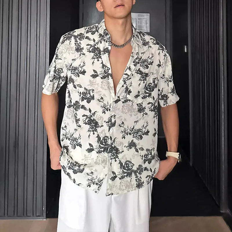 White loose-fit short sleeve casual shirt with a floral print and an open cardigan style front.