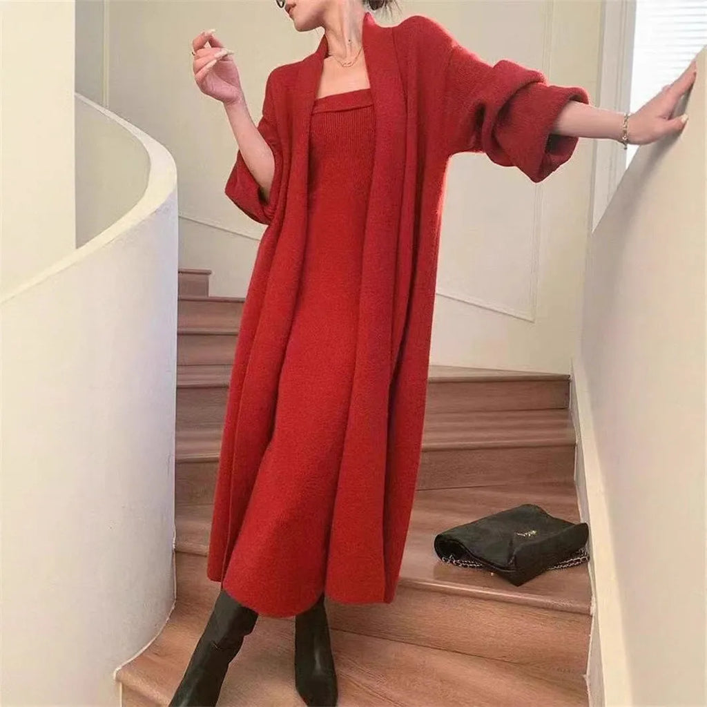 Women's grey knitted cardigan and long skirt two-piece set with flocking detail.