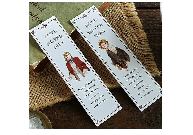 Pack of 30 white cardboard art bookmarks with designs including flowers and patterns, next to their plastic carton.