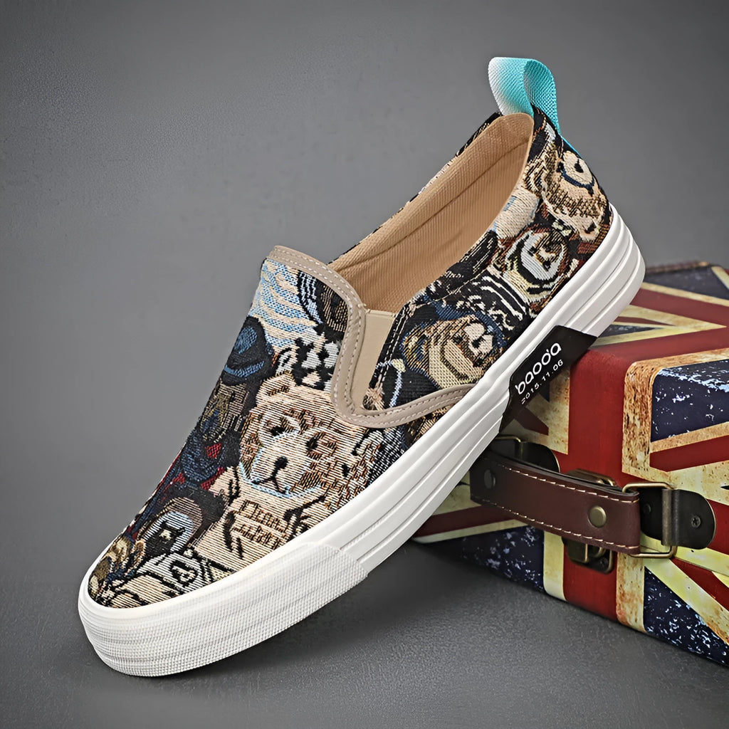 Khaki canvas slip-on sneakers with vulcanised rubber sole and mesh lining on a white background.