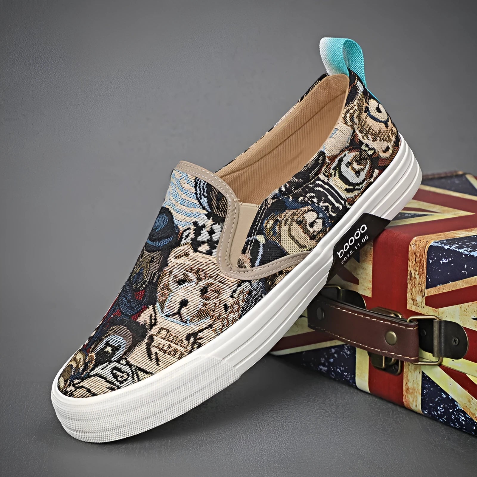 Khaki canvas slip-on sneakers with vulcanised rubber sole and mesh lining on a white background.