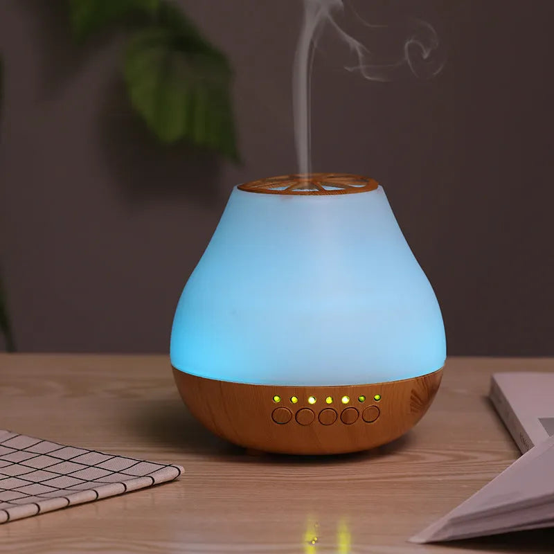 USB essential oil diffuser with wood grain finish and colourful LED mood lighting