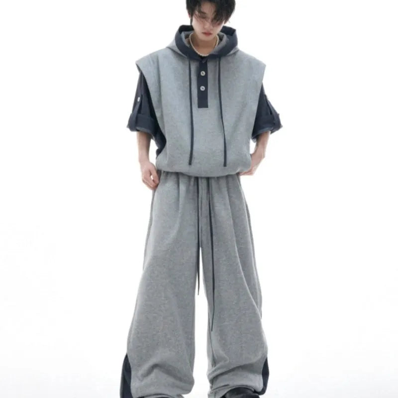 Men's black hooded polyester sports suit with three-dimensional stitching and matching trousers