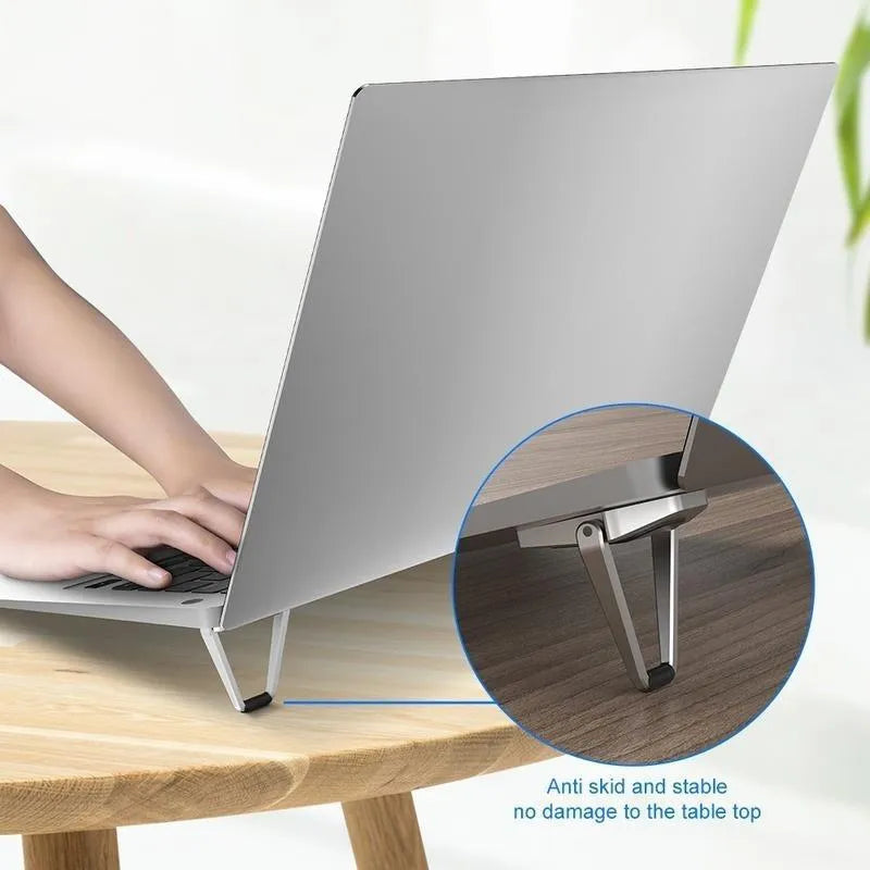 Folding aluminum alloy laptop bracket showing compact 4.8cm size with adhesive backing