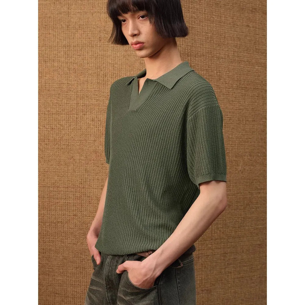 Man wearing a beige short-sleeve polo shirt with a striped collar, showcasing business casual summer style.