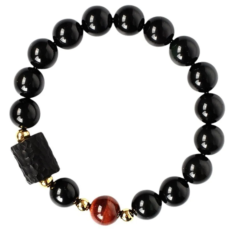 Obsidian bracelet with yellow tiger eye beads showing retro circular design