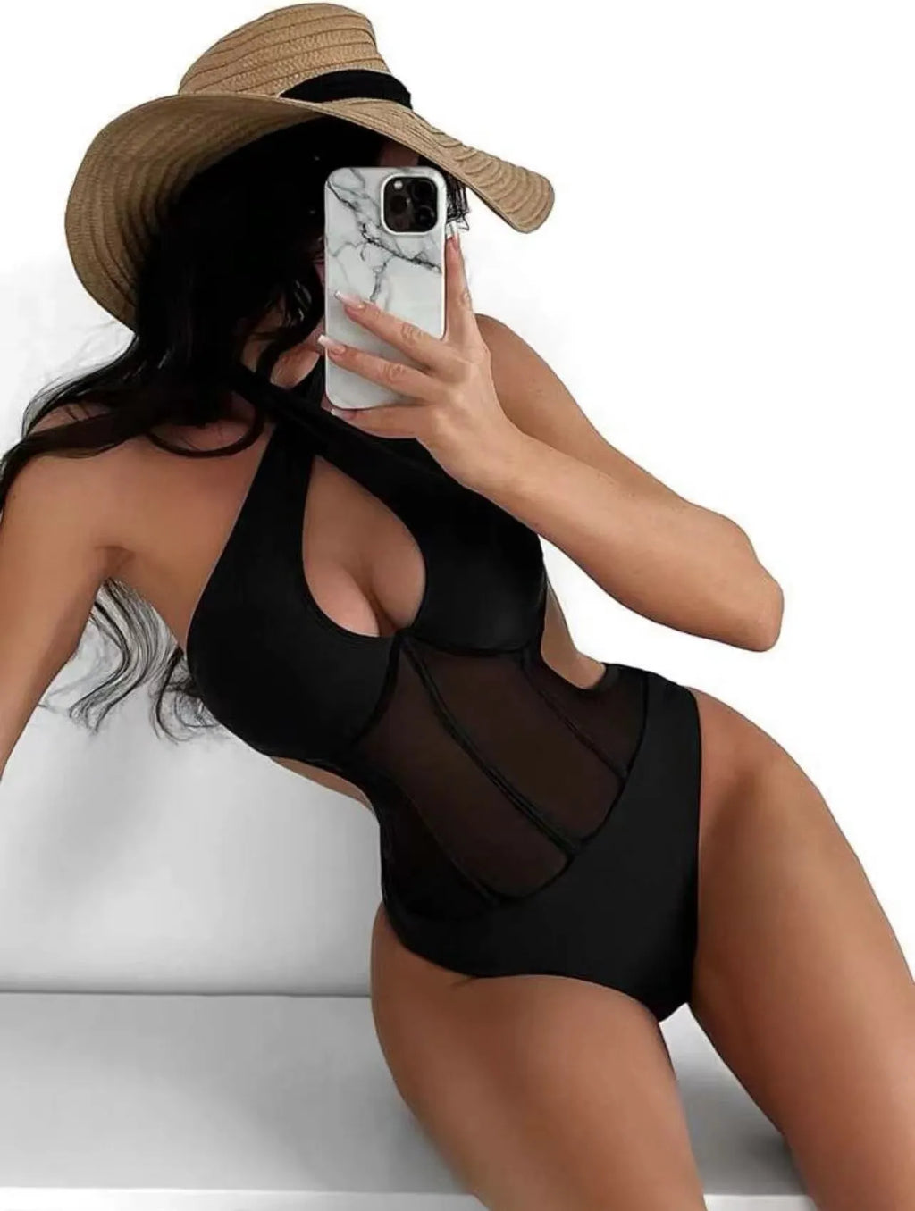 Black one-piece bikini swimsuit for women on a mannequin, showing the front design.