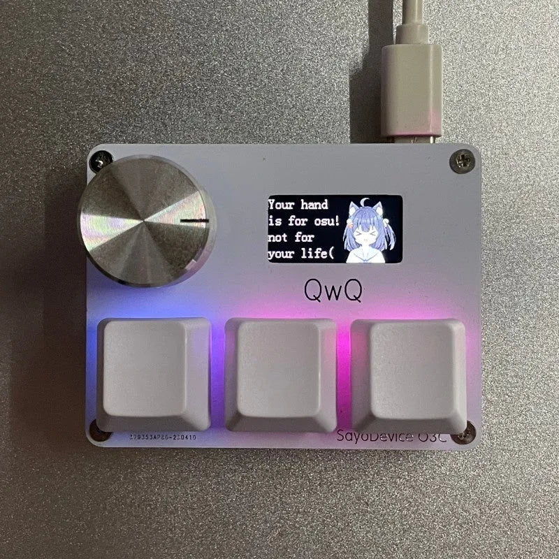 Magnetic axis numeric keyboard with IPS screen, programmable knob, and RGB backlit keys in black, pink, silver, or white.