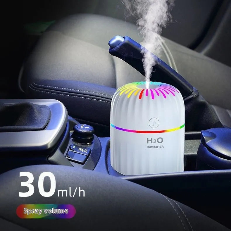 Green mini car-shaped USB aromatherapy humidifier on a white background.