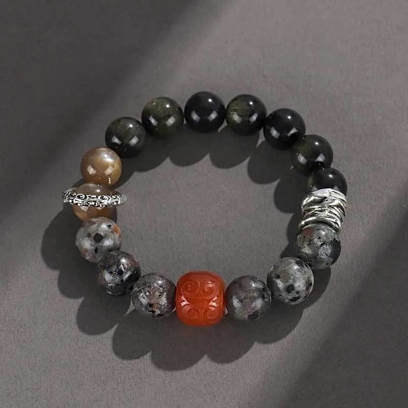 Handcrafted gold obsidian and red agate stone bracelet with Wukong pattern design