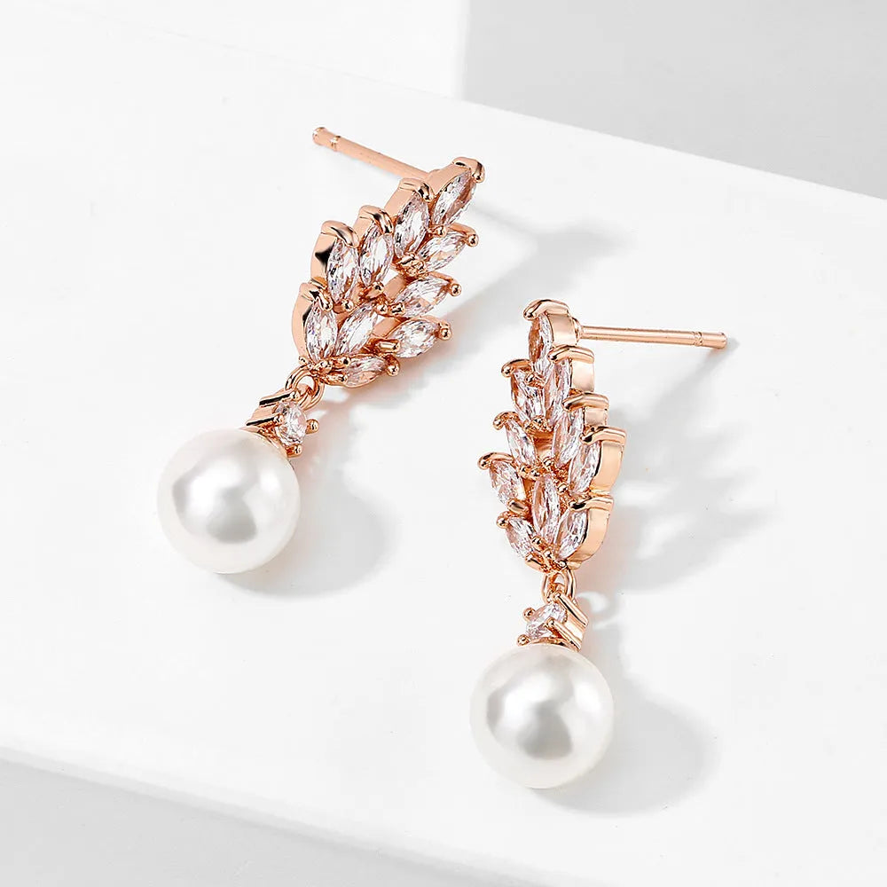 Geometric flower shape stud earrings with micro inlaid zircon stones in gold, rose gold, or white gold plating.