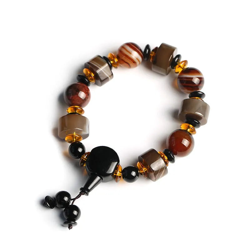 Old agate bracelet with A13 sardonyx bead, white agate spacers, and red agate barrel bead in geometric ethnic design