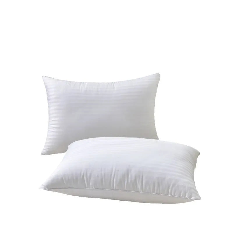 White cotton satin stripe feather pillow showing simple design and hotel-style aesthetic