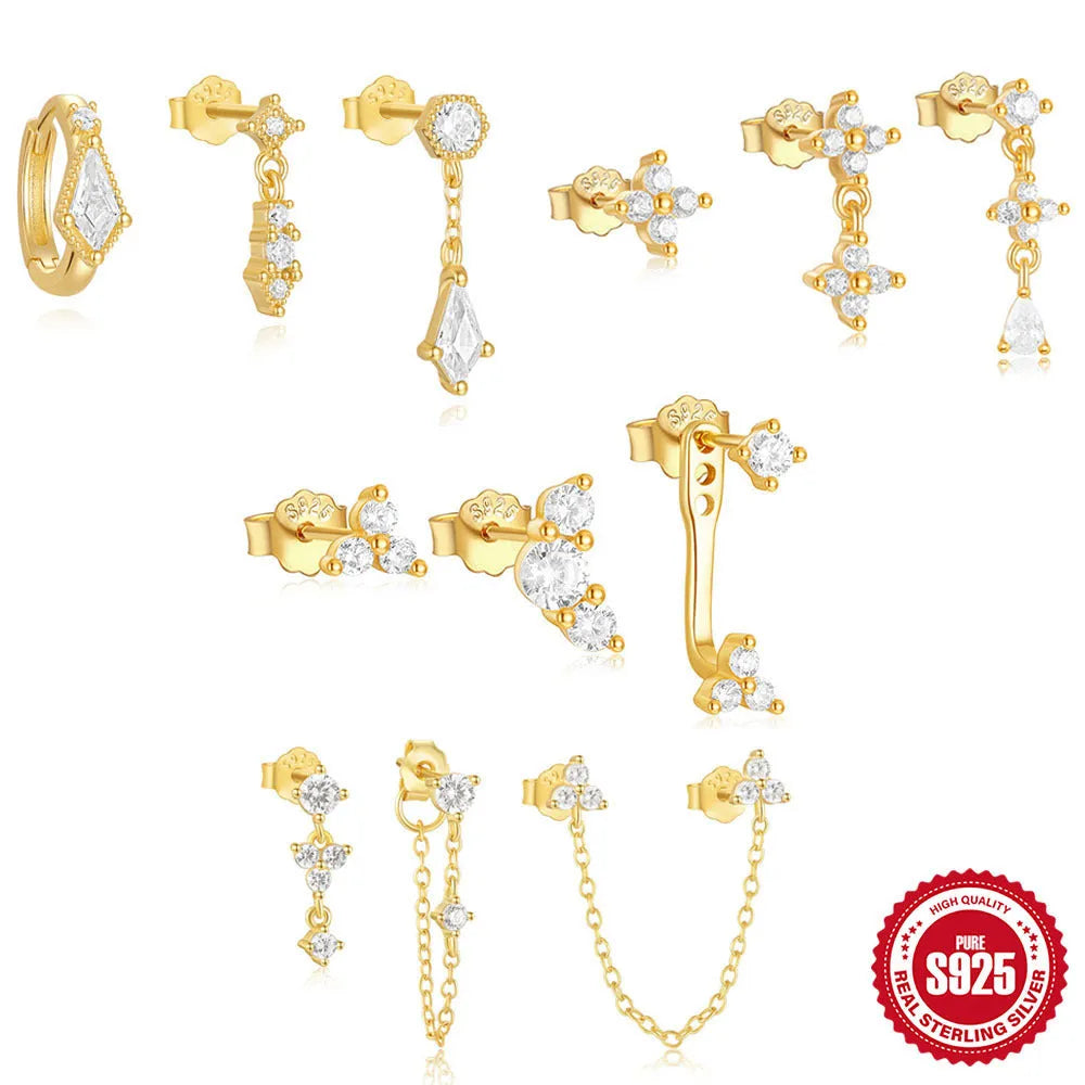 Geometric gold tone sterling silver earrings with a tassel drop and cubic zirconia stones.