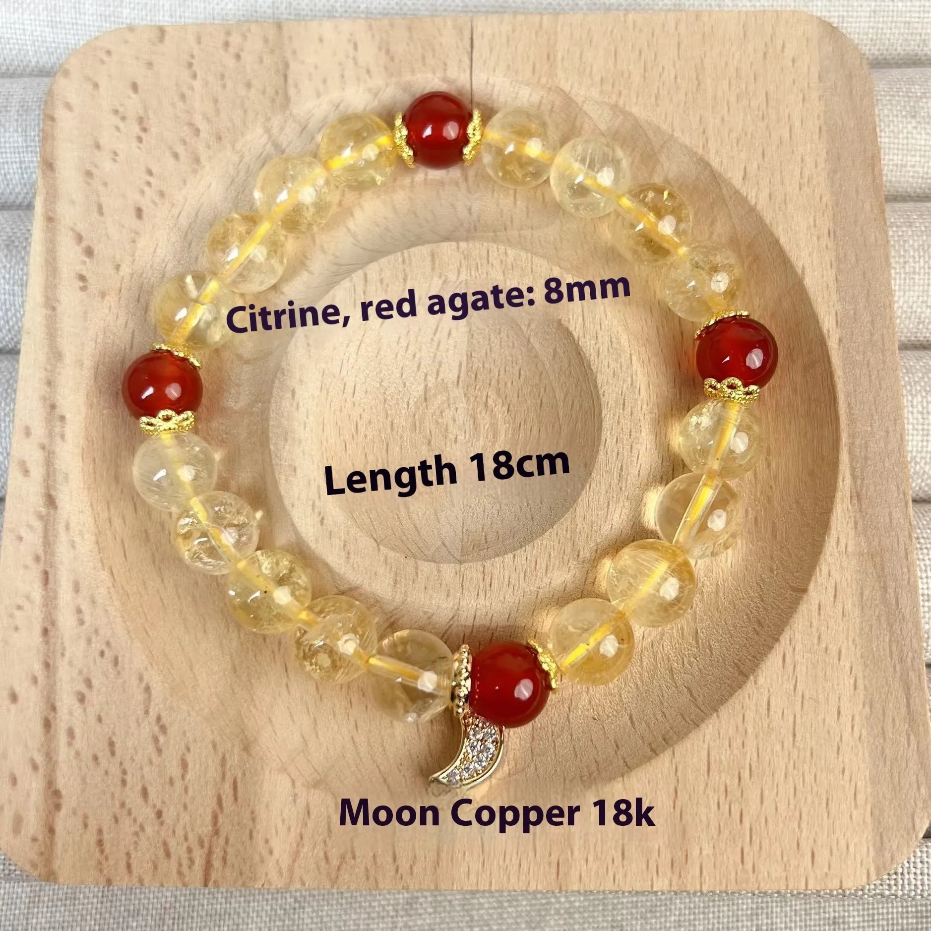 Women's handmade crystal bracelet featuring citrine and red agate beads in a moon boom style.