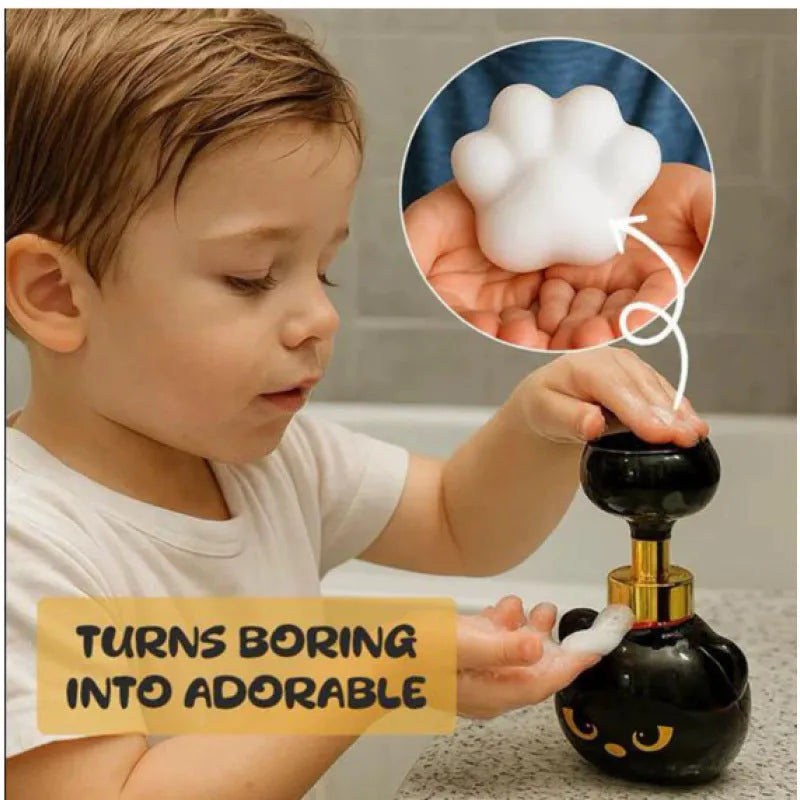 Black cartoon cat-shaped plastic foam soap dispenser measuring 10cm wide by 18cm tall