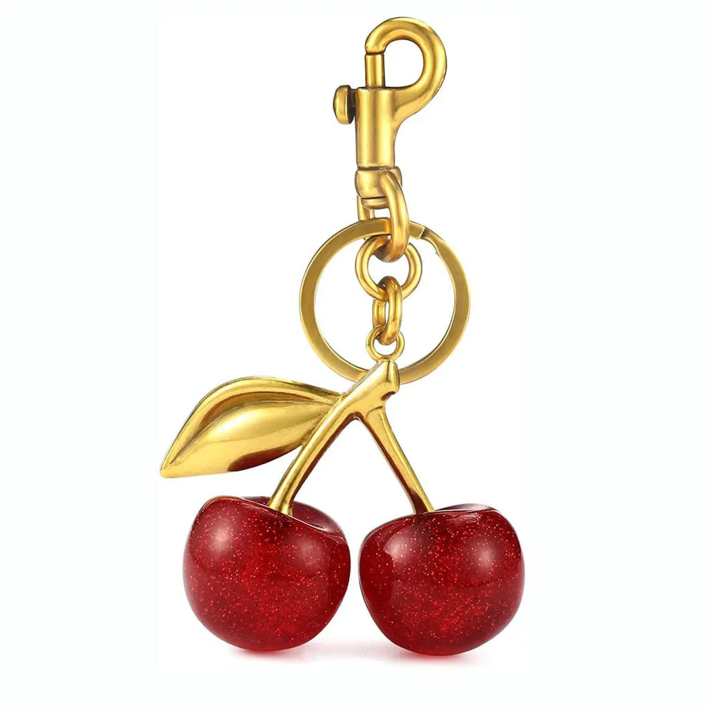 Three-dimensional red zinc alloy cherry pendant charm on a key ring.