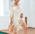 Apricot women's crocheted patchwork beach dress with half sleeves on a hanger.