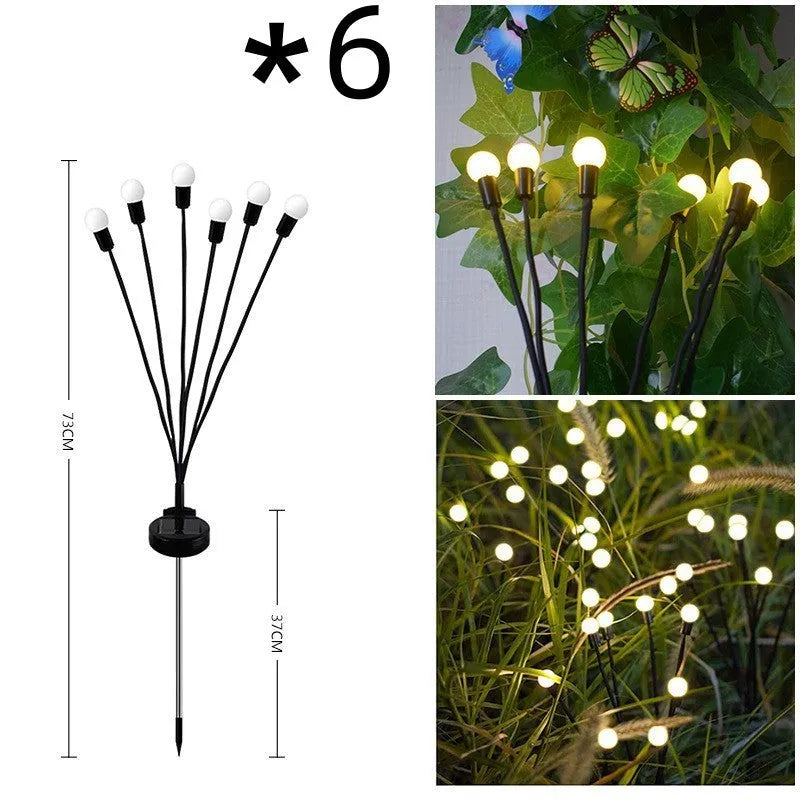 Solar-powered LED garden light with multiple heads on stainless steel ground spikes