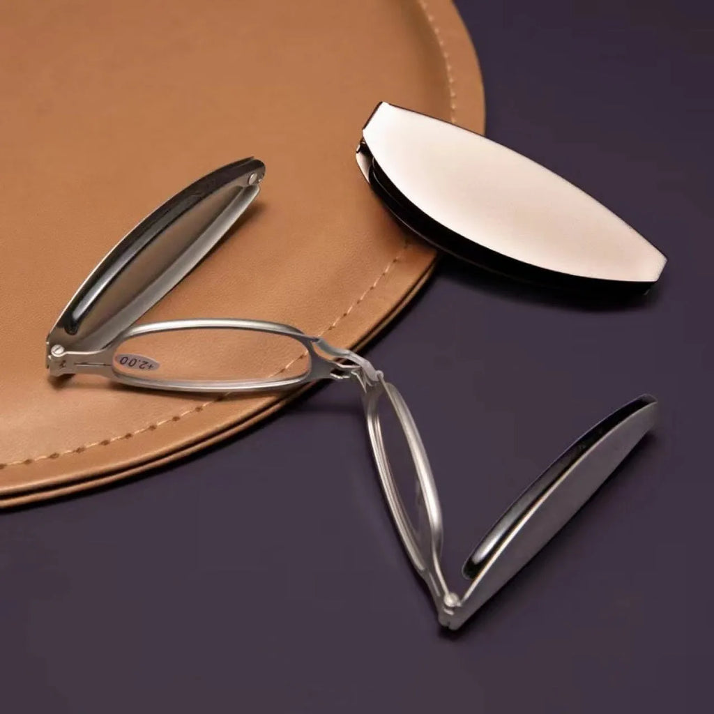 Black folding presbyopic glasses shown open and folded, with retro ring-style frame.
